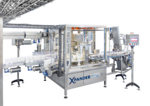 Xpander, Stuffer, liquids filling, sealing, capping Monoblock for rolls in canisters
